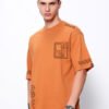 Bewakoof Men's Orange Sippin Sun Graphic Printed Oversized T-shirt